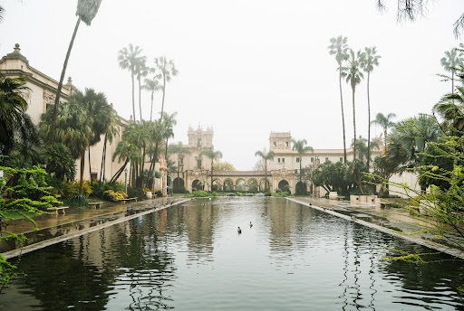 Balboa Park Cue Sports. The air is filled with the sweet fragrance of blooming flowers, and the sounds of birdsong and rustling leaves create a peaceful ambiance. You can feel the gentle breeze as you stroll along the winding paths, passing by towering trees and vibrant gardens. Although you can't see the stunning architecture of the museums and cultural institutions, you can appreciate the intricate details and historical significance through touch and sound. The park is a sensory experience, inviting you to explore its beauty through your imagination.